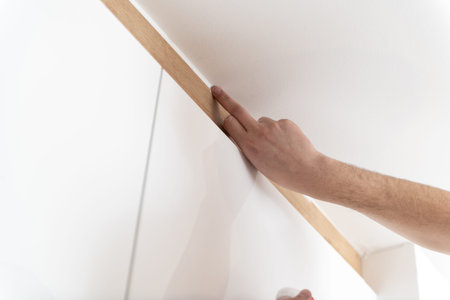 Construction Worker Use Finger Applying Silicone for Repairing and Installing Kitchen in House