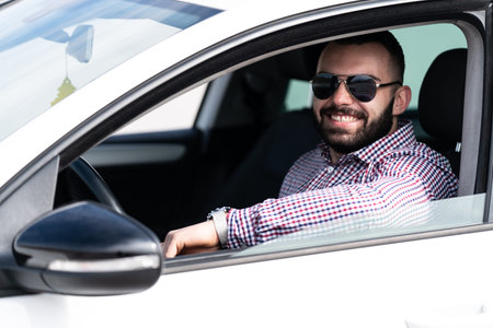 Portrait of a Man Driver in His Car