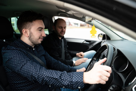 Driving Instructor and Man Student in Examination Car Testing Learner Driver