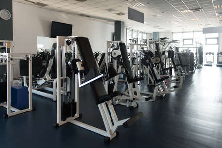 Modern Gym Room Fitness Center With Equipment And Machinesの写真素材