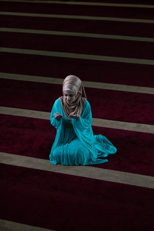 Humble Muslim Woman Is Praying in the Mosque