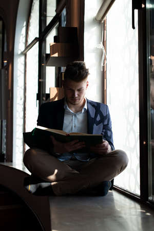 Attractive Man Making Traditional Prayer to God Allah in the Mosqueの写真素材