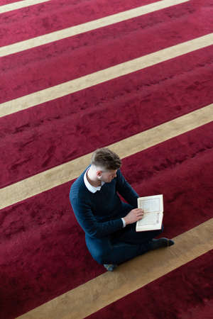 Businessman Muslim Making Traditional Prayer to God Allah in the Mosqueの写真素材
