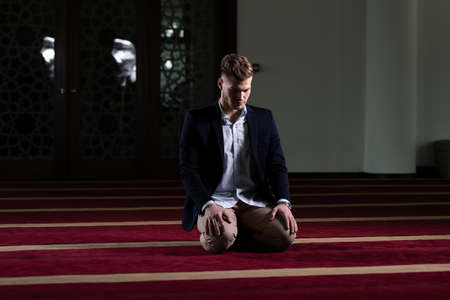 Businessman Muslim Making Traditional Prayer to God Allah in the Mosqueの写真素材