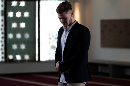 Businessman Muslim Making Traditional Prayer to God Allah in the Mosque