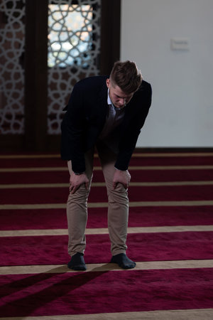 Businessman Muslim Making Traditional Prayer to God Allah in the Mosque