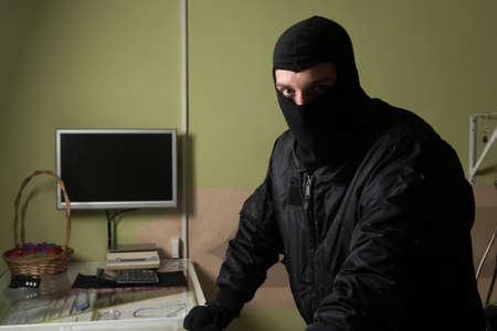 Man Wearing a Mask Robbed a Jewelry Store - Robbery Conceptの写真素材