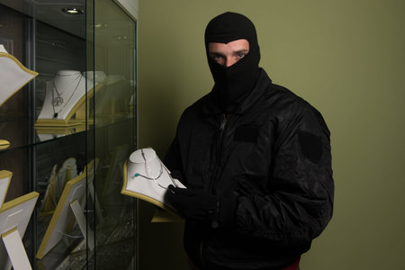 Man Wearing a Mask Robbed a Jewelry Store - Robbery Concept