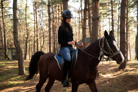 Young Woman Rider With Her Horse Enjoying Good Mood in Evening Sunset Light