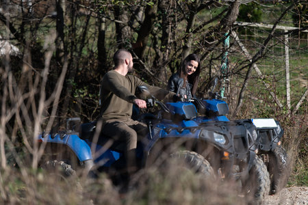 Couple on the Atv Quad Bike on the Mountains Roadの写真素材