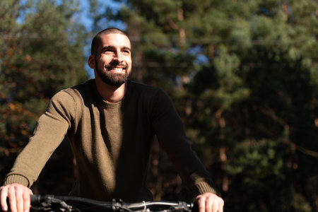 Mountain Biker Riding on Bike in Summer Mountains Forest