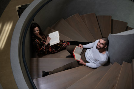 Students Preparing Exam and Learning Lessons for School on Spiral Stairs Architecture Art