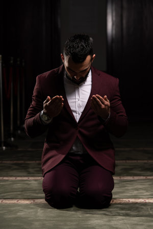 Portrait of a Young Adult Muslim Man is Praying in the Mosqueの写真素材