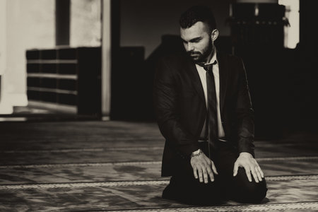 Portrait of a Young Adult Muslim Man is Praying in the Mosque