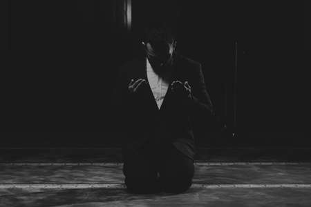 Portrait of a Young Adult Muslim Man is Praying in the Mosqueの写真素材