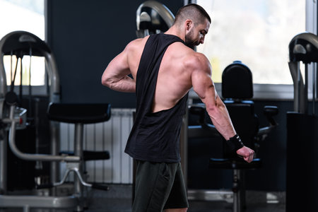 Portrait Of A Young Physically Fit Man Showing His Well Trained Body - Muscular Athletic Bodybuilder...