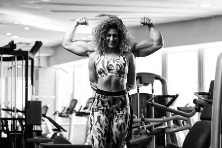 Portrait Of A Physically Fit Couple Showing Their Well Trained Body - Muscular Athletic Bodybuilder Fitness Model Posing After Exercisesの写真素材