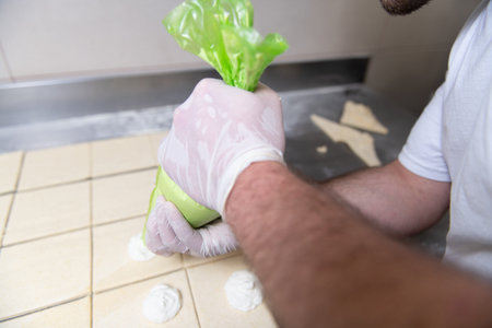 Young Pastry Chef Making Some Cheese Croissant in the Bakery Cooking Process Before Going to the...