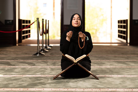 Humble Muslim Woman Holding Hands Up and Praying in Peace