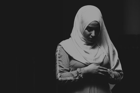 Beautiful Muslim Woman in Hijab Dress in Mosque and Prayingの写真素材