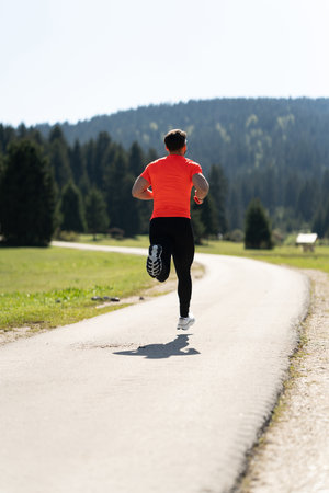Fitness Enthusiast Enjoys A Sunny Day While Joggingの写真素材