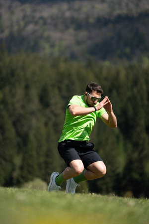 Man Jumping To His Maximum Height In Open Airの写真素材