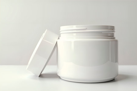 White Cosmetic Jar with Open Lid on Clean White Surfaceの素材