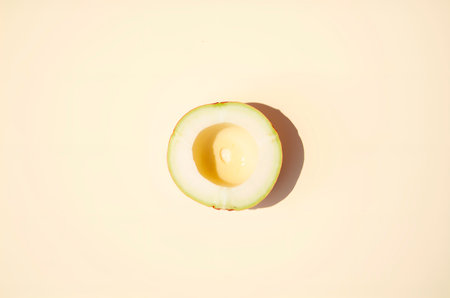 Sliced Avocado on Yellow Background - Healthy Food Still Lifeの素材