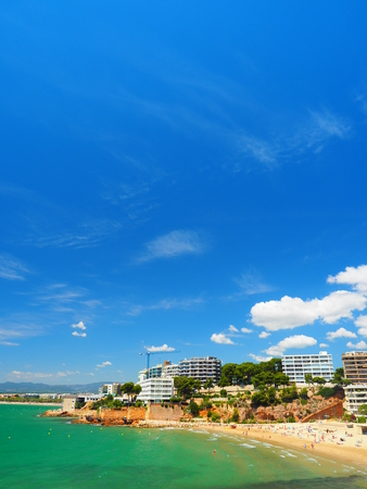 Tropical Beach with Green Sea and Bright Blue Skyの写真素材