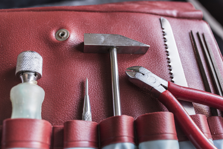 tools in red leather caseの写真素材