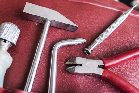 tools in red leather caseの写真素材