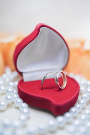 Wedding rings with diamonds in a gift boxの写真素材