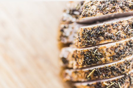 Sliced baked chicken fillet on the right side of the frameの写真素材