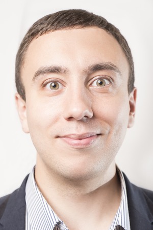 Portrait of a happy smiling businessman, isolated on a white backgroundの写真素材