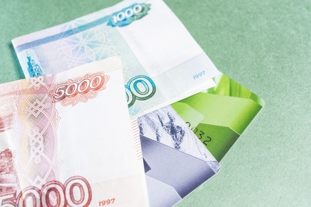 Credit cards, money on a green backgroundの写真素材