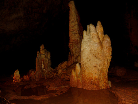 Stalagmite formation next to a puddleの写真素材