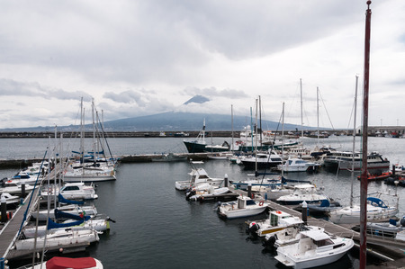 Horta harbor capital of Faial, Azores. In the background the island of Pico.の写真素材