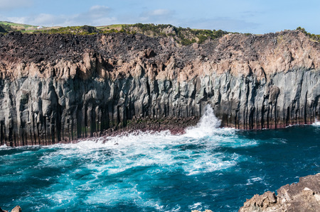 Volcanic cliffs on the coast of the island of Terceira, Azores, Portugal.の写真素材