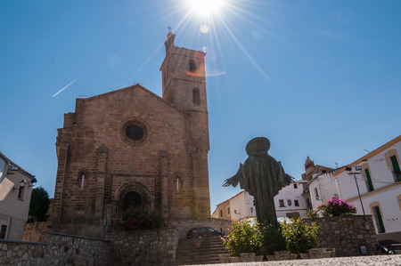 Spain Square with the monument to San Pedro de Alcantara and the church of Santa Maria de Almocovar, Alcantara, Extremadura, Spain.のeditorial素材