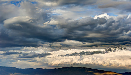 Storm Clouds over Mountain Range mean Rain and Poor Weather.