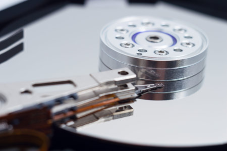 A opened computer electronic hard drive closeup