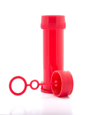 Red plastic bottle of soap bubbles isolated on white backgroundの写真素材