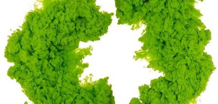 Abstract paint background colored of green ink splash in the water isolated on white backgroundの写真素材