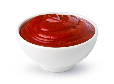 One bowl of red tomato ketchup isolated on a white backgroundの写真素材