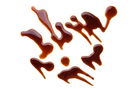 Puddle of tasty soy sauce isolated on a white backgroundの写真素材