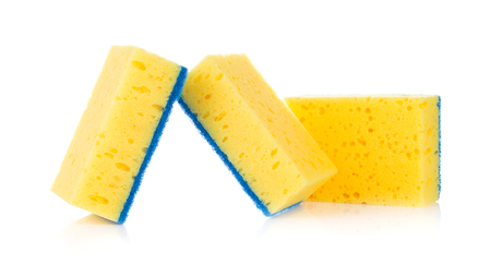 yellow sponges for cleaning ware isolated on white backgroundの写真素材