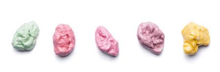 pink green red yellow collection of chewed bubble gum isolated on white backgroundの写真素材