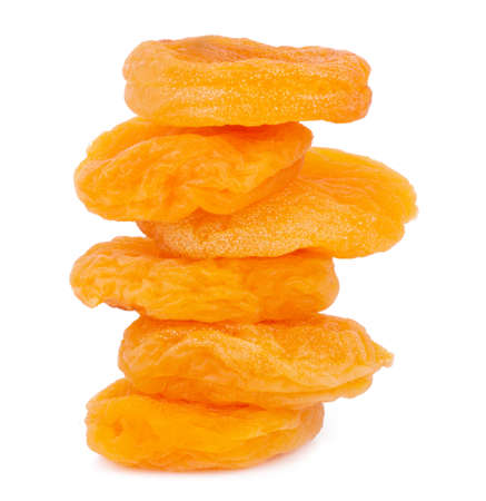 Group of yellow dried apricots isolated on white background.の写真素材