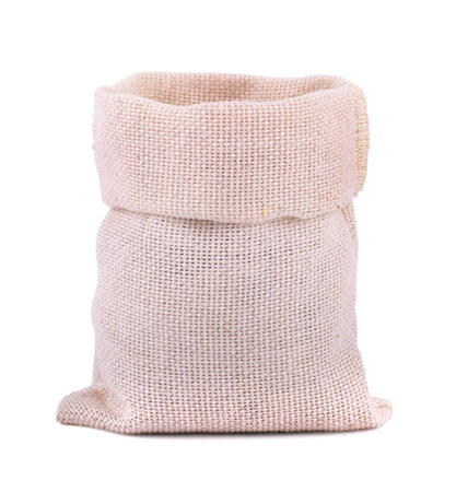 Three burlap sack bags with rice isolated on white background.の写真素材