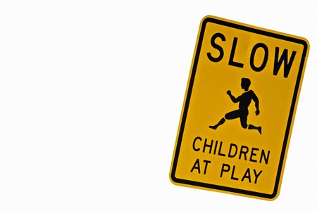 slow children at play sign on plain solid white backgroundの写真素材